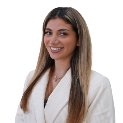 Portrait of a smiling blonde female wearing a white blazer.