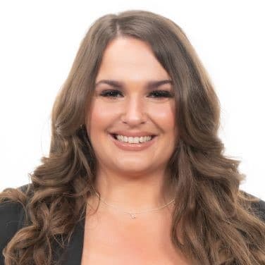 Smiling brunette female with long hair.